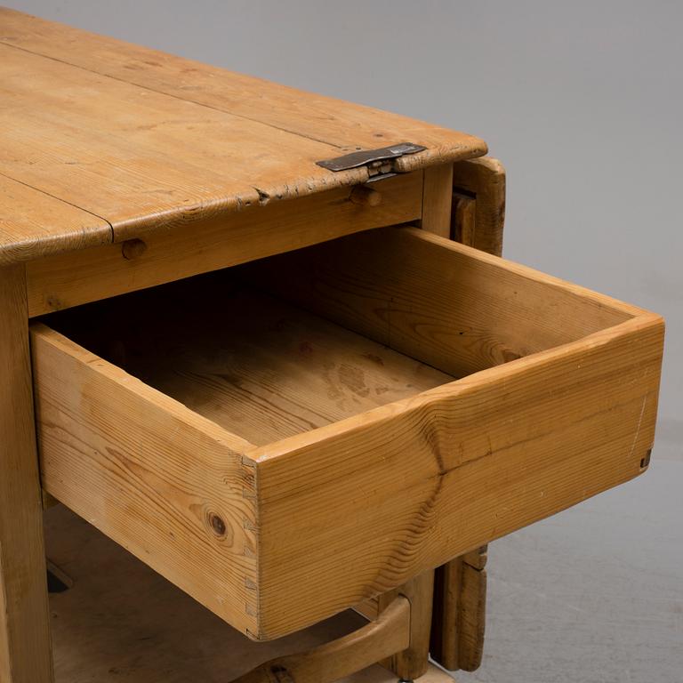 A 19th century pine flap table.
