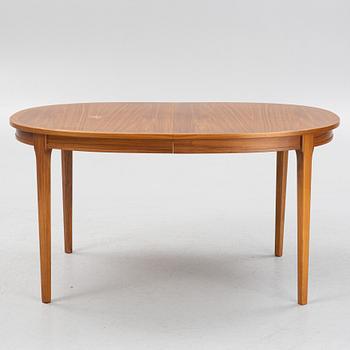 A teak-veneered dining table, second half of the 20th century.