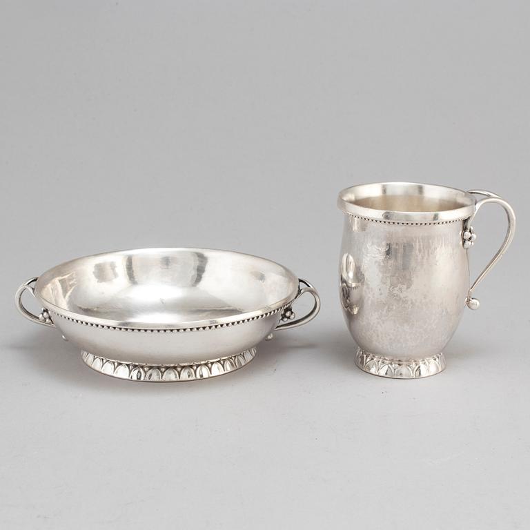 GEORG JENSEN,  a 830/1000 silver mug and  a bowl (a christening set), Copenhagen ca 1918-1927, design nr 127, 158.