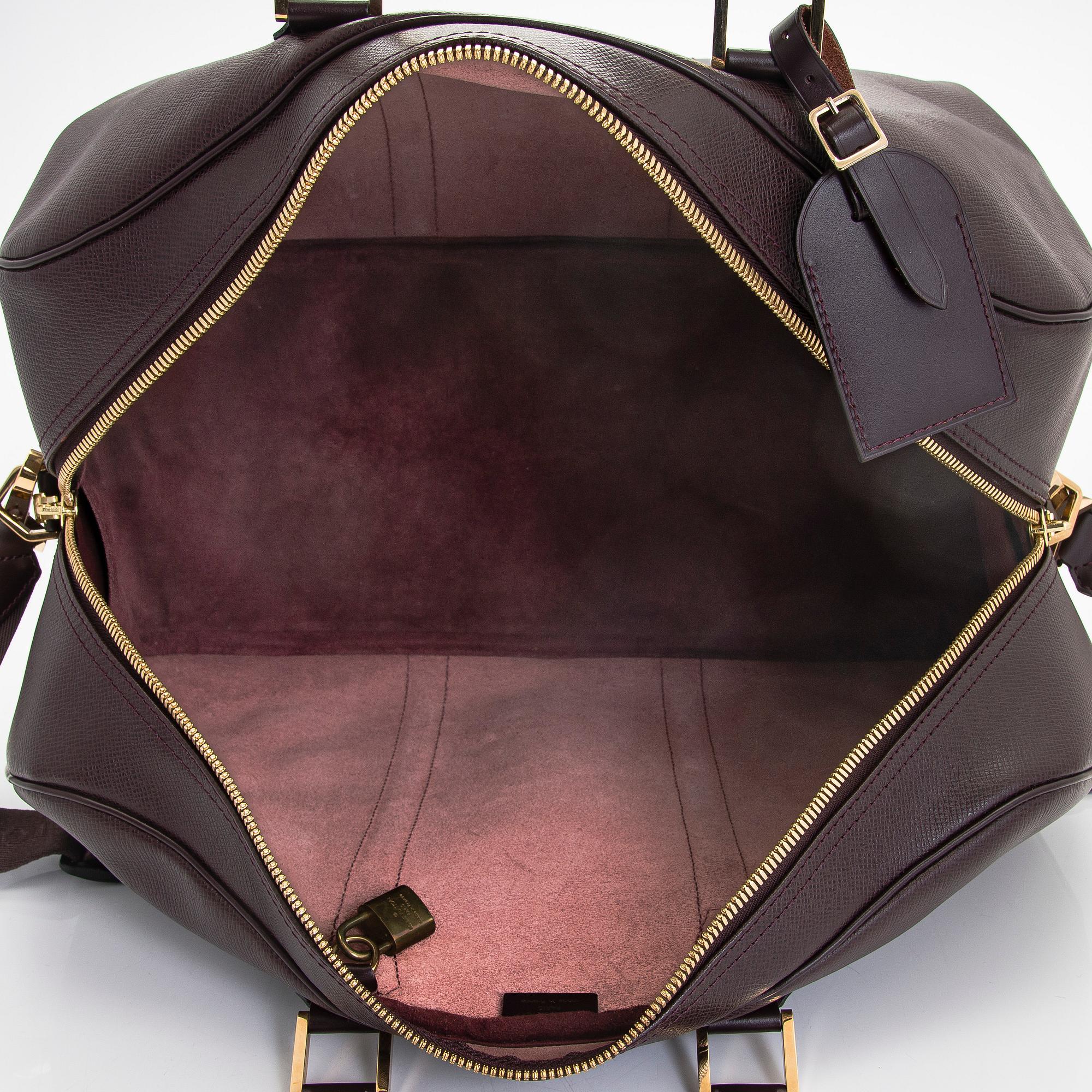 Louis Vuitton, a 'Taiga Kendall PM' weekend bag.