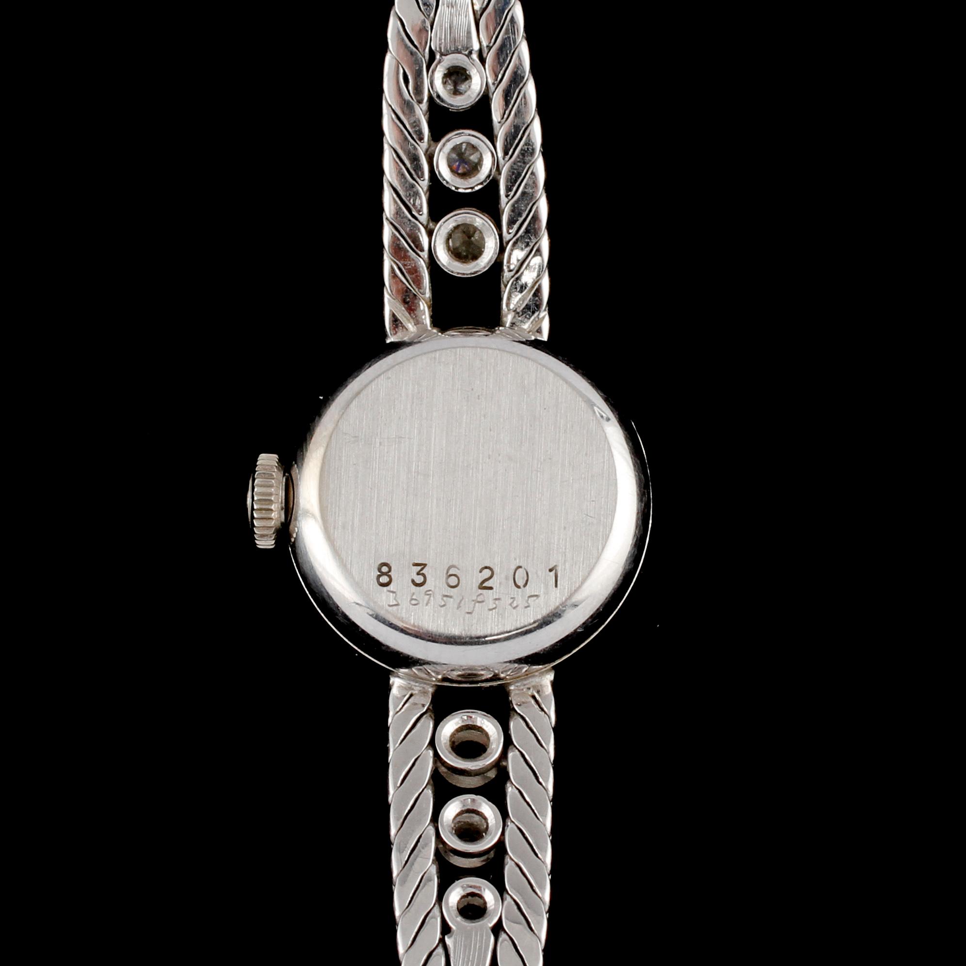 DAMARMBANDSUR, Certina, 18k vitguld med 6 briljantslipade diamanter, omkring 1900-talets mitt. Vikt 19 g.