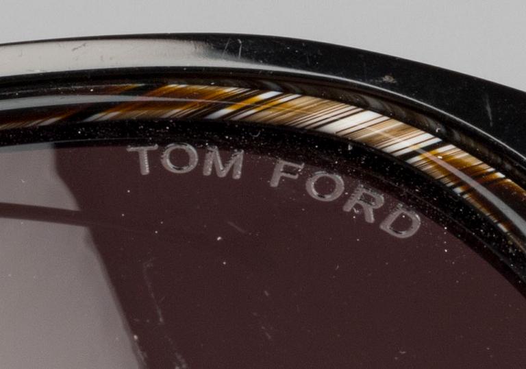 Two pair of Tom Ford Sunglasses.