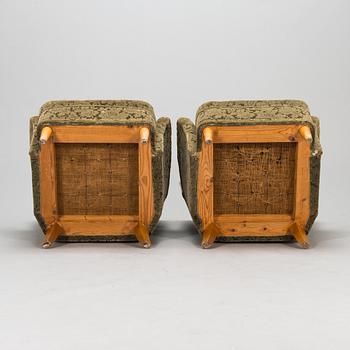 A pair of 1950s armchairs.