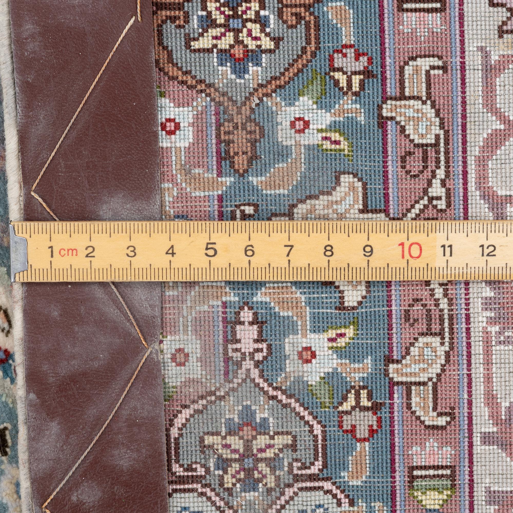 A Tabriz, carpet, 310 x 195 cm. signed.