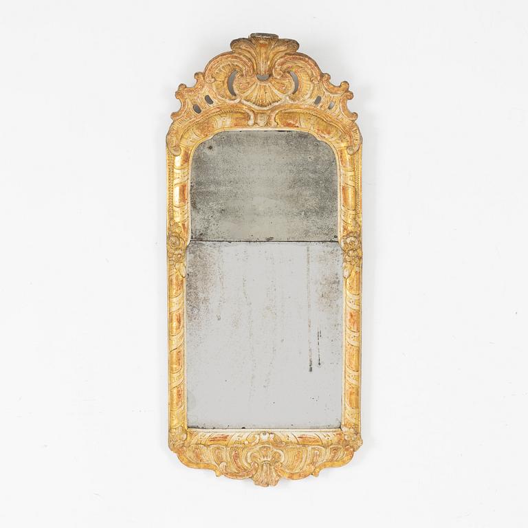 A Swedish rococo giltwood mirror, later part of the 18th century.