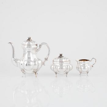 A Rococo Style Silver Coffee Pot, Creamer and Sugar Bowl, Swedish import mark.