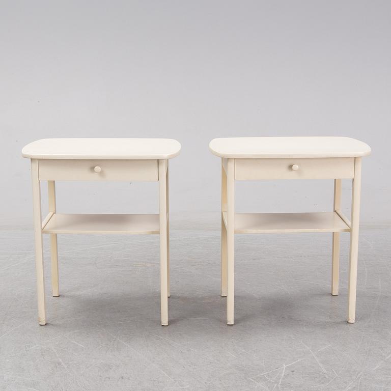 A mid 20th Century pair of bedside tables.