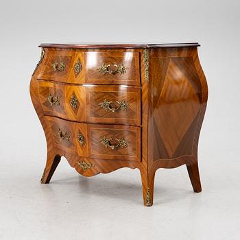 A Rococo style chest of drawers, mid-20th century.