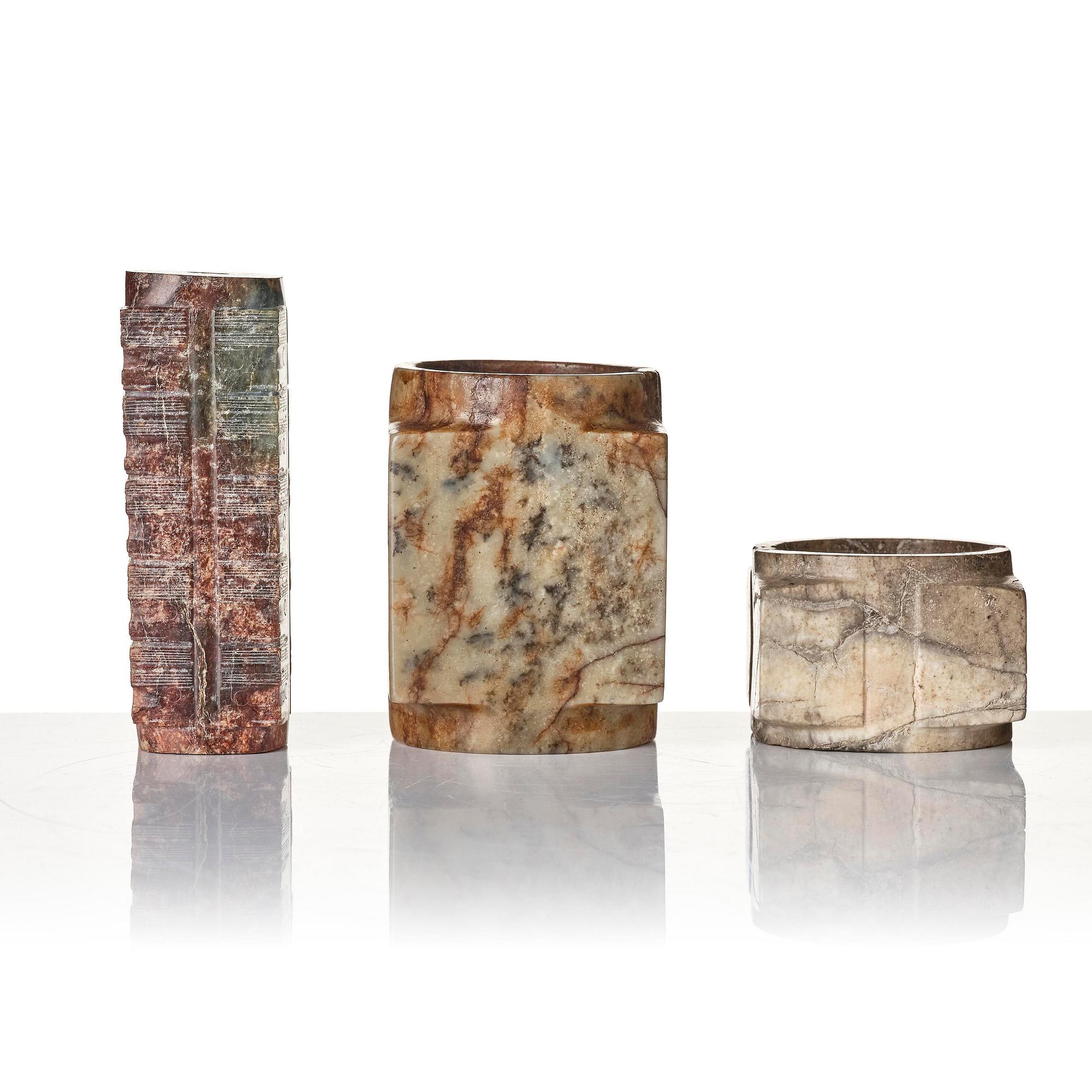 A group of three archaistic stone congs.