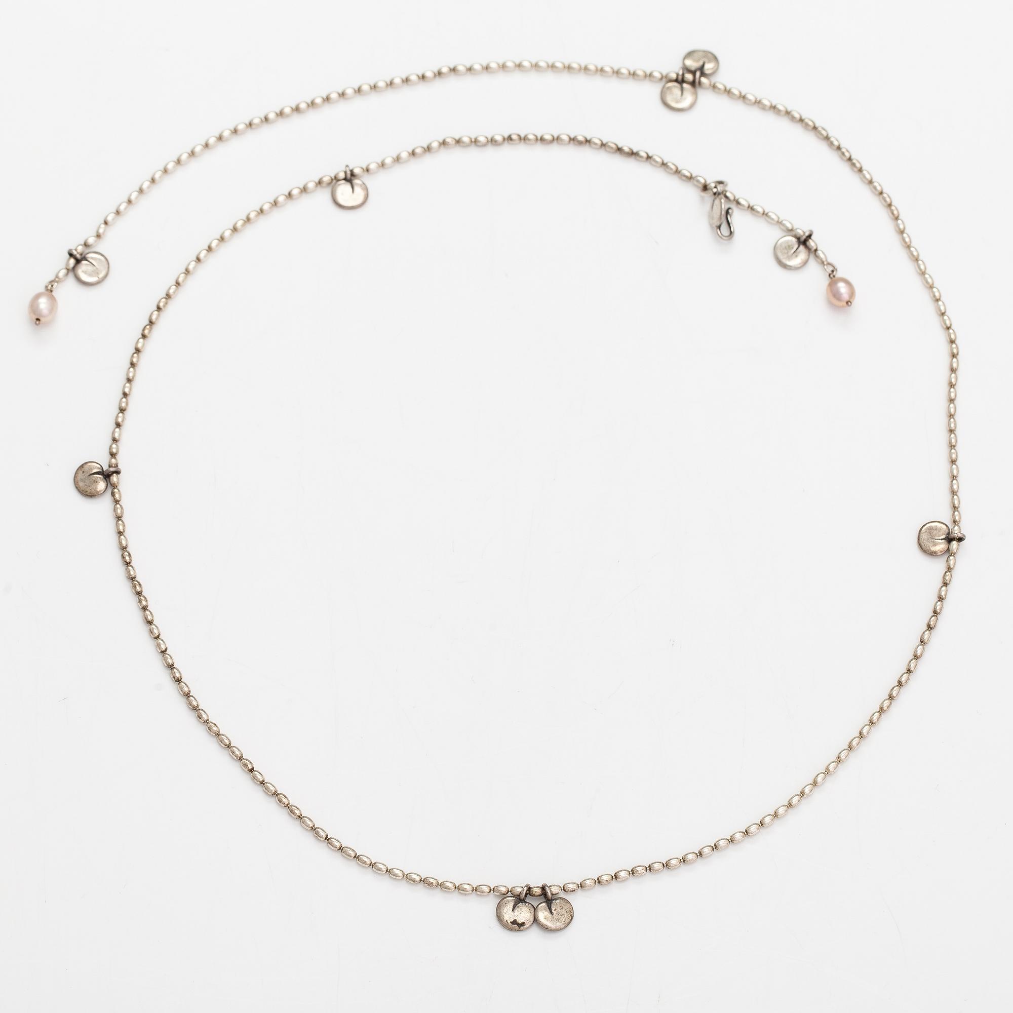 Kirsti Doukas, a necklace, pair of earrings and two bracelets, 'Vanamo', sterling silver, and cultured pearls.