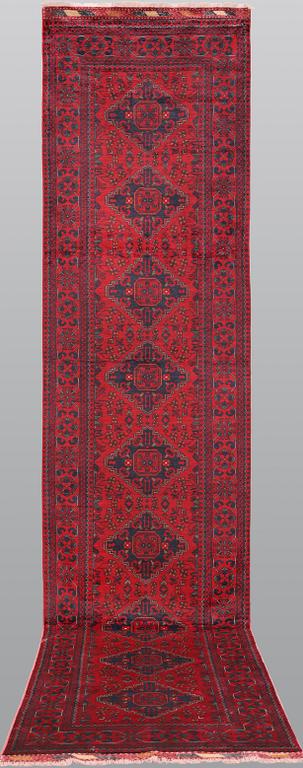 An Afghan runner, c. 390 x 91 cm.