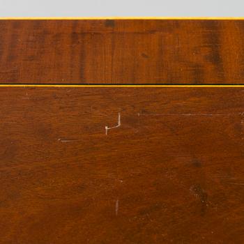 An Empire console table with mirror from around 1810.