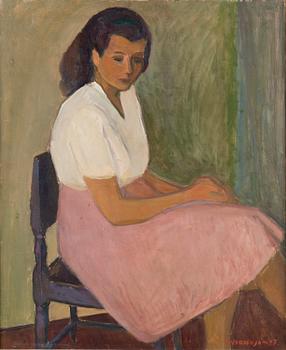 VEIKKO VIONOJA, A WOMAN SITTING.