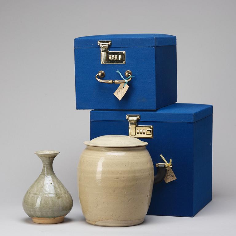 A celadon glazed jar with cover and a vase, South East Asia, 16/17th Century.