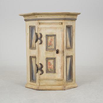 A 18th century corner cabinet.