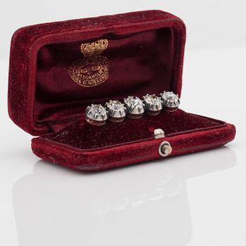 An old-cut diamond brooch set with five diamonds of varying colour. Total carat weight of diamonds circa 8.00cts.