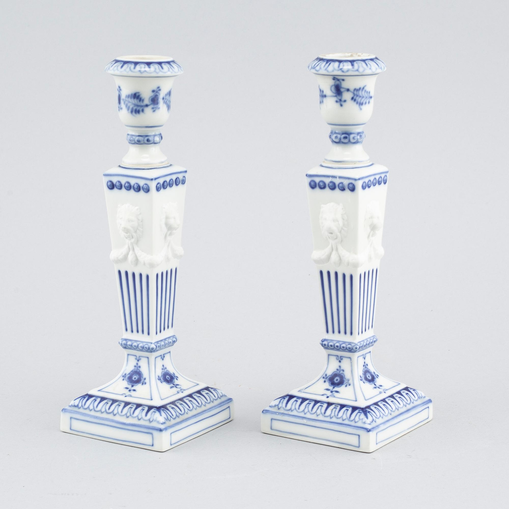 A pair of "Musselmalet" candlesticks in porcelain, by Royal Copenhagen, second half of the 20th century.