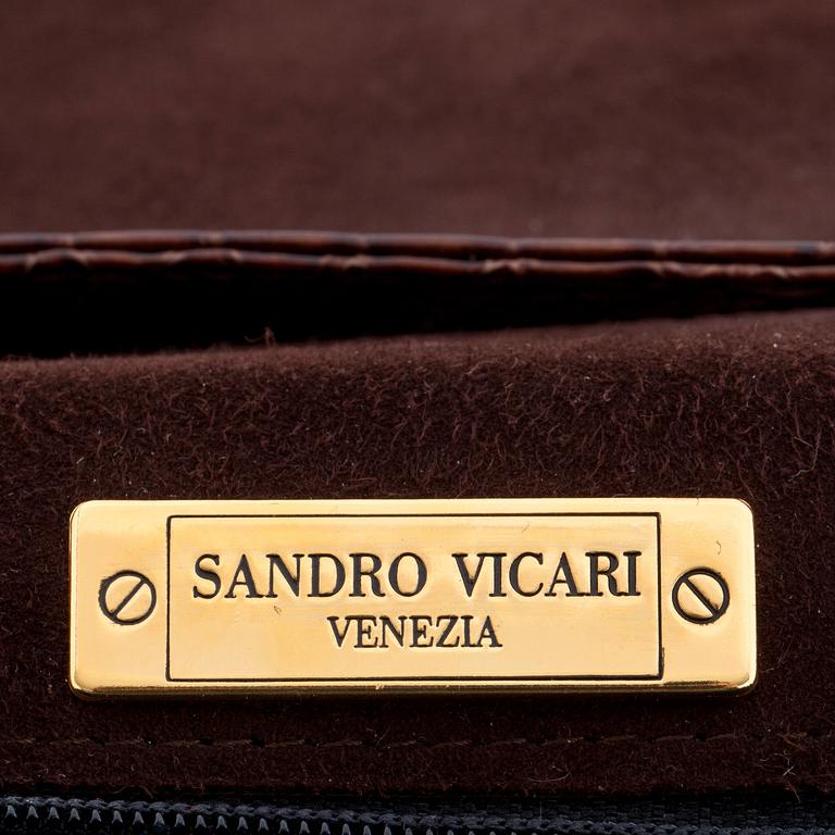 SANDRO VICARI, a brown snakeskin shoulder bag.