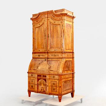 A German walnut and mahogany writing cabinet around 1800.