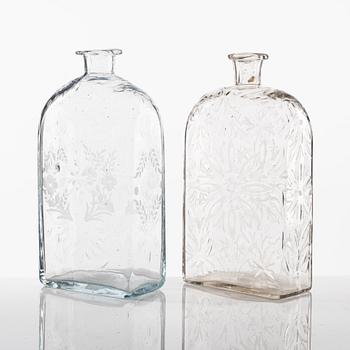 Two engraved glass bottles, late 18th Century/circa 1800.