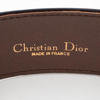 CHRISTIAN DIOR, a black leather belt.