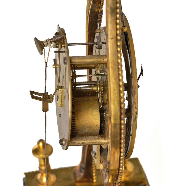 A French Louis XVI ormolu and marble lyre-shaped mantel clock, late 18th century.