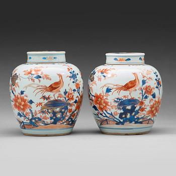 A pair of imari jars with covers, Qing dynasty, 18th Century.