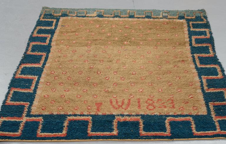 A RYA BED COVER, possibly signed I W, dated 1823, ca 170-176,5 x 136,5-141,5 cm.