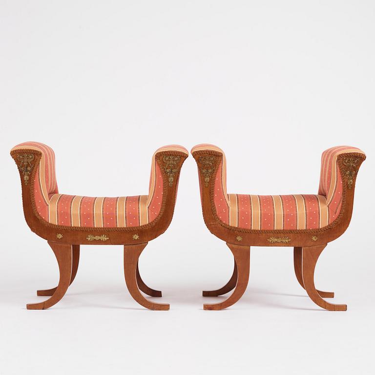 A pair of Swedish Royal Empire stools.