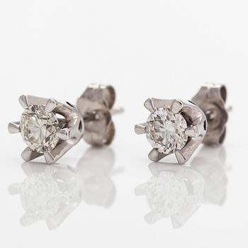 A pair of 14K white gold, earrings 
 with brilliant-cut diamonds totalling approximately 0.74 ct.