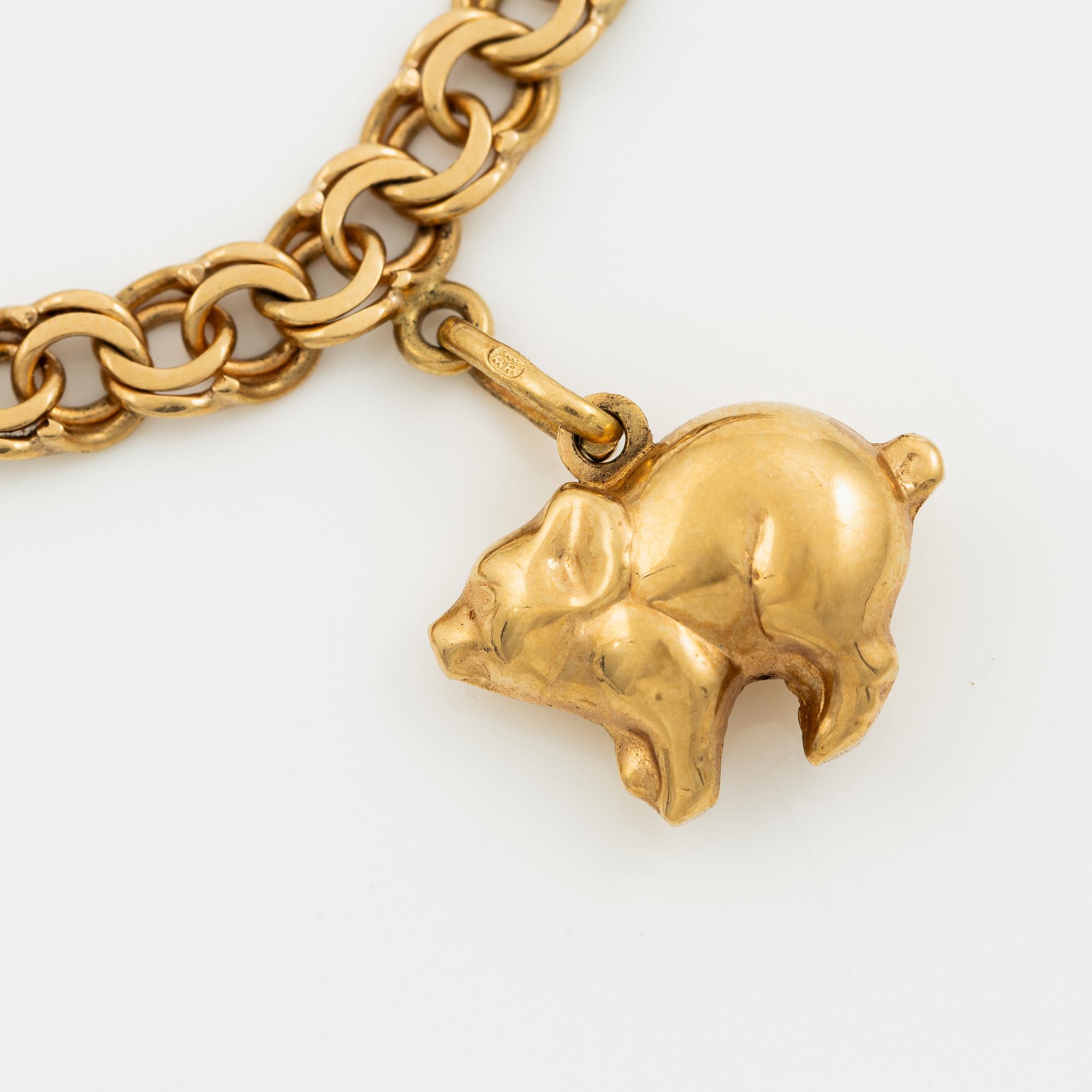 Bracelet, 18K gold with charms.