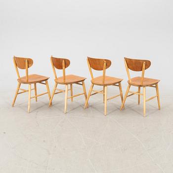 A set of four birch and teak veneered chairs from Bröderna Wigells stolfabrik, Malmbäck mid 20th century.