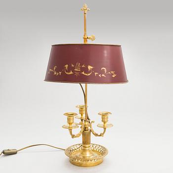 A gilt bronze bouillotte lamp for three candles, first half of the 20th century.