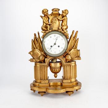 An Empire gilded table clock marked Vaillant Paris.