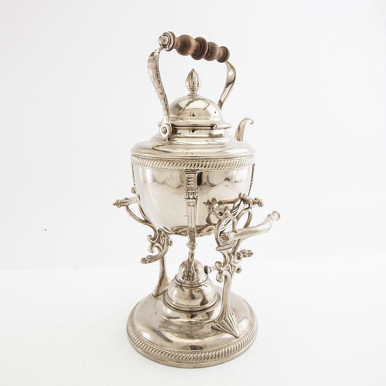 Tea kettle with a burner around 1900.