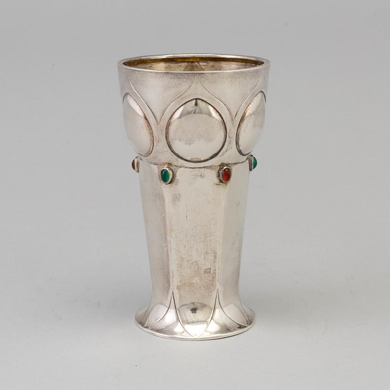 A Swedish Art Nouveau parcel-g beaker decorated with carneols and garnets, maker's mark Julia Anderson, Stockholm, 1909.