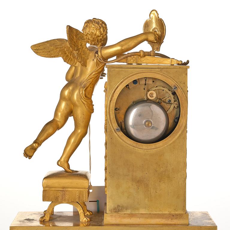 An Empire ormolu figural mantel clock, early 19th century.