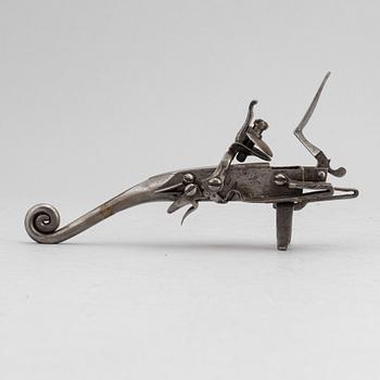 An 18th Century flintlock tinder lighter.