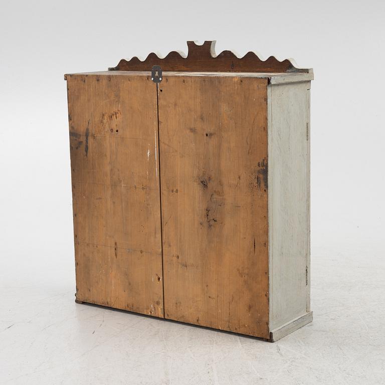 A wall cabinet, 19th Century.