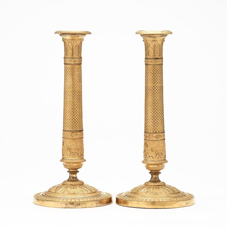 A pair of Empire early 19th century candlesticks.