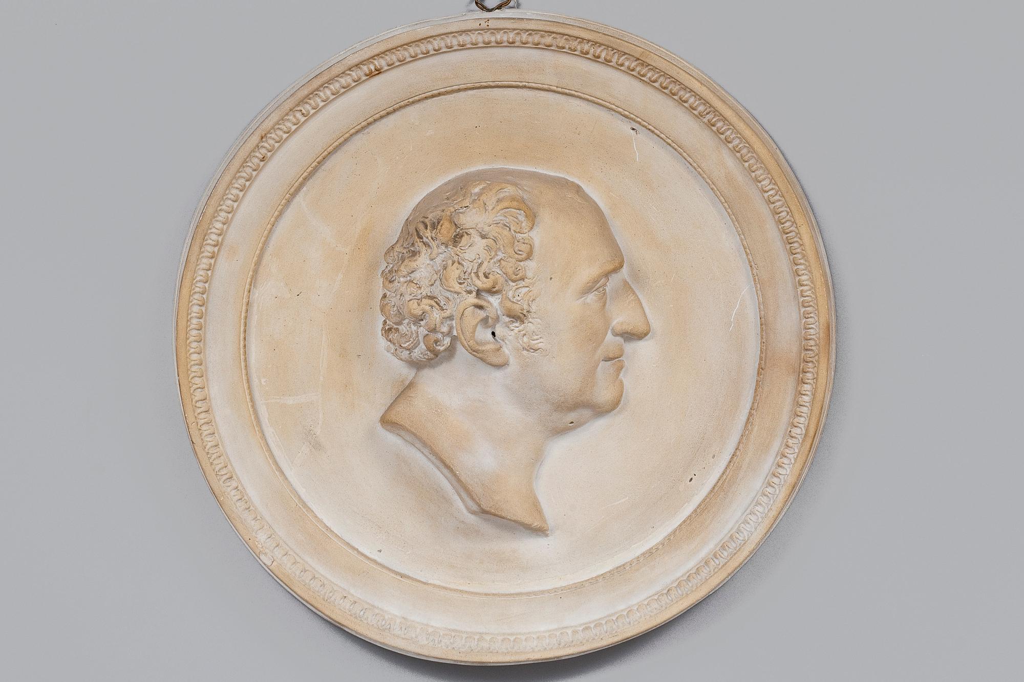A WALL MEDALLION.