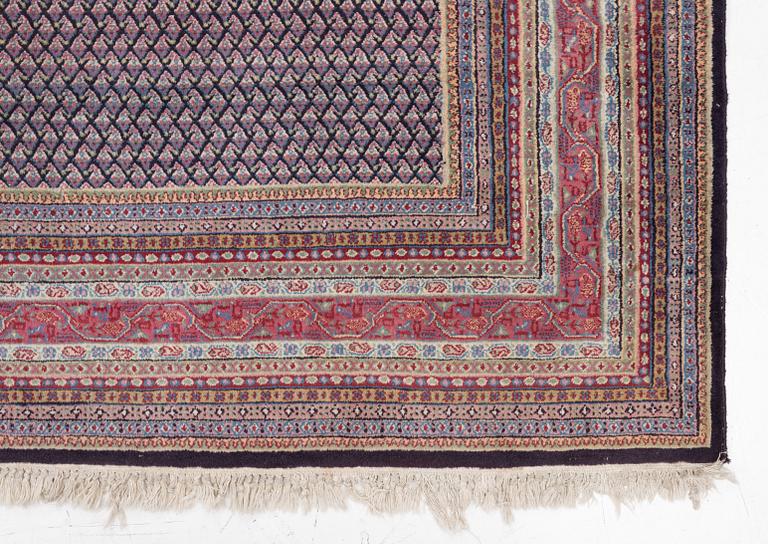 A oriental carpet, signed, c. 295 x 295 cm.