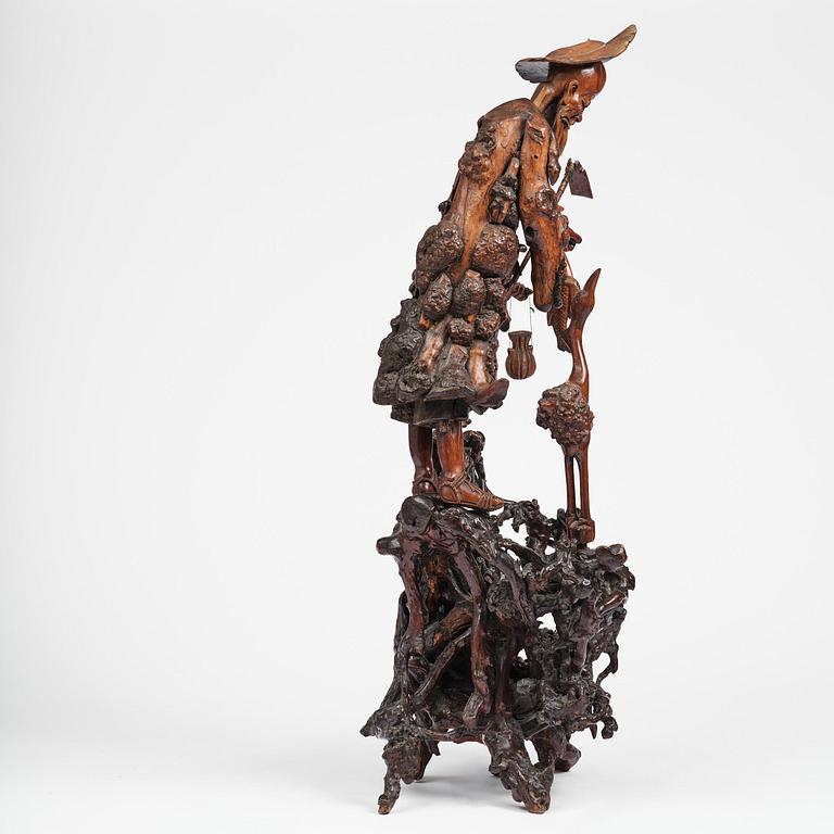 A large well sculptured root sculpture of 'Sholau and attendant', late Qing dynasty, 19th century.