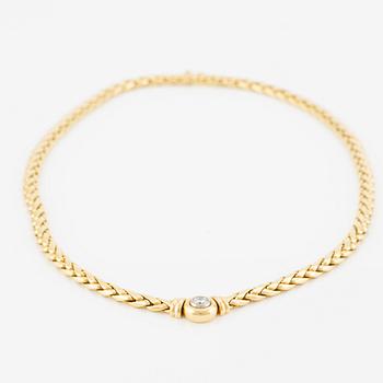 A necklace/bracelet combination in 18K gold set with a round brilliant-cut diamond ca 0.35 ct.