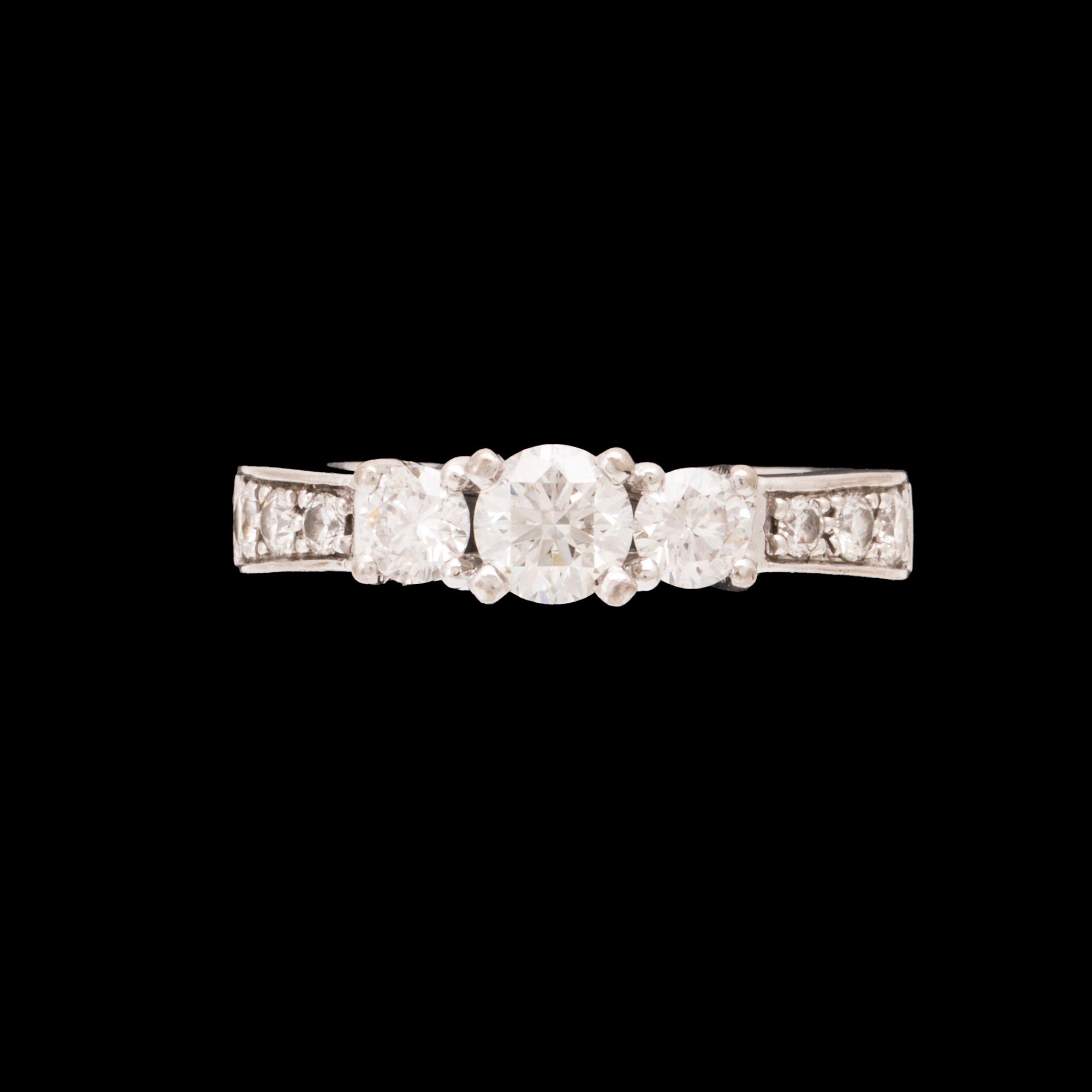 An 18K white gold ring set with round brilliant cut diamonds.