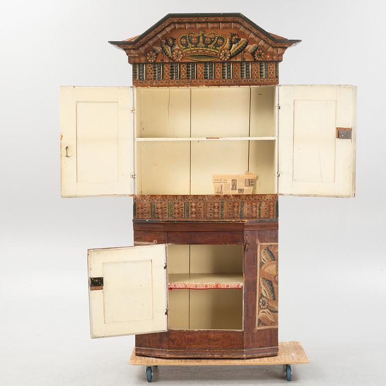 A Swedish traditional painted cabinet, dated 1819.