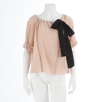 PRADA, a powder pink blouse with black ribbon. Size 40.