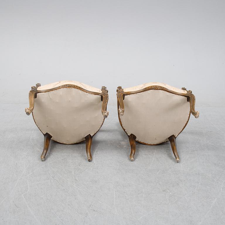 A pair of Louis XV-style arm chairs, 20th century.