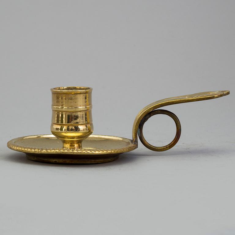 A 18th century bronze candlestick.