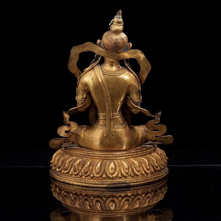 A large gilt bronze figure of Tara, with Qianlong mark.